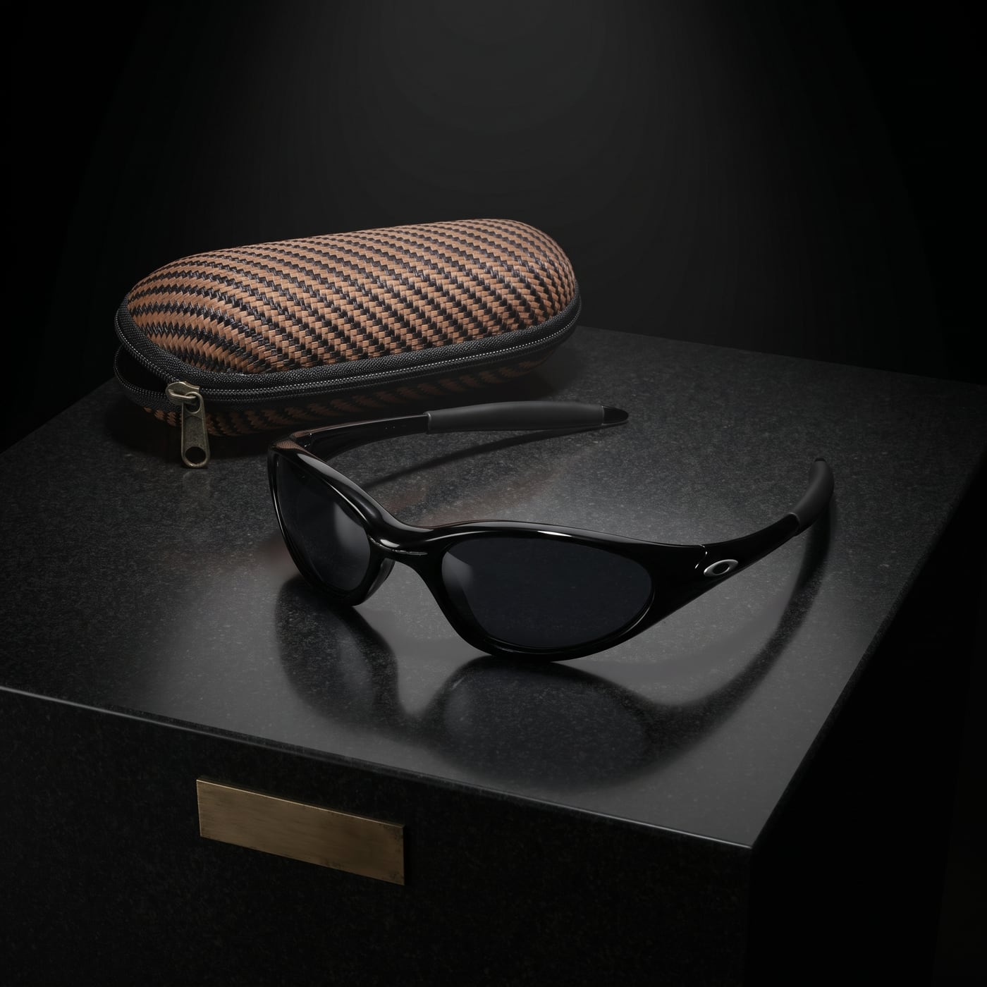 Vintage sunglasses and woven case on granite pedestal