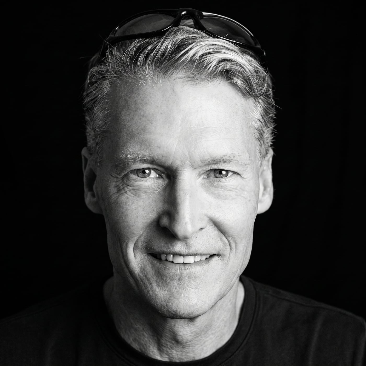 Black-and-white portrait, sunglasses pushed up